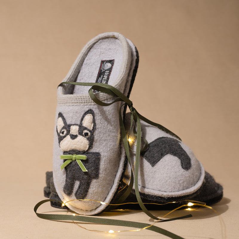 Close-up of adorable puppy embroidery on Haflinger wool slipper