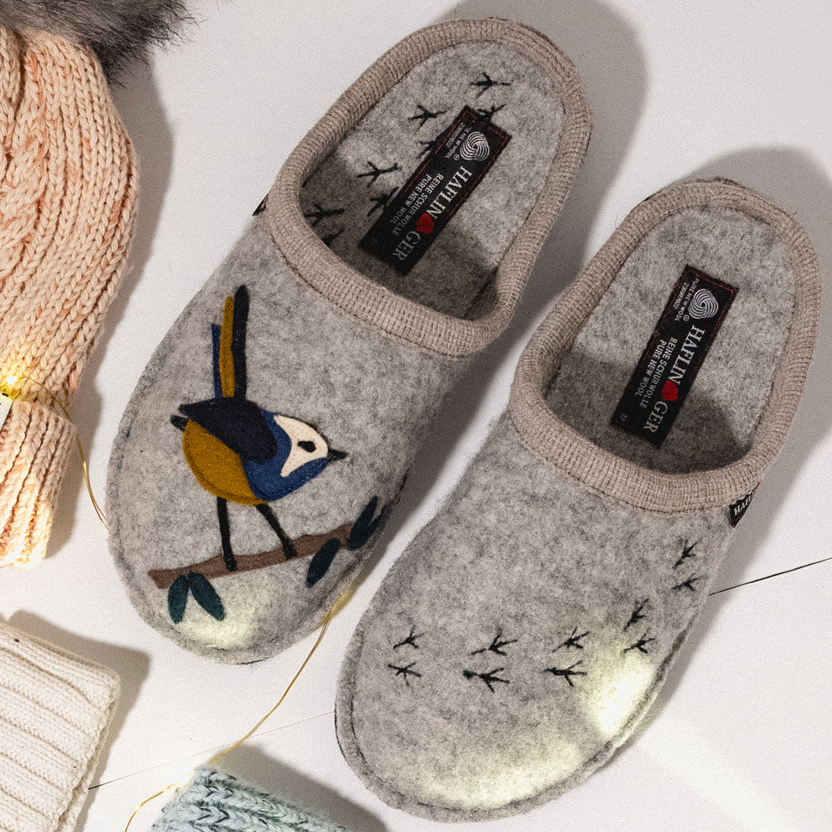 Detail overhead shot of the Haflinger Songbird wool slipper featuring a cozy boiled wool design and felt bird applique 