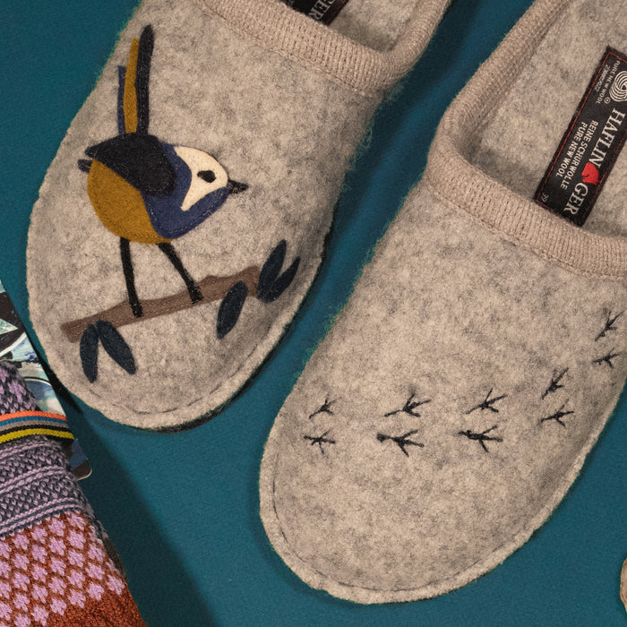 Detail overhead shot of the Haflinger Songbird wool slipper featuring a cozy boiled wool design and felt bird applique 