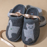 Overhead view of Haflinger Wool Slippers with charming cat appliqués on the front. Perfect gift for her