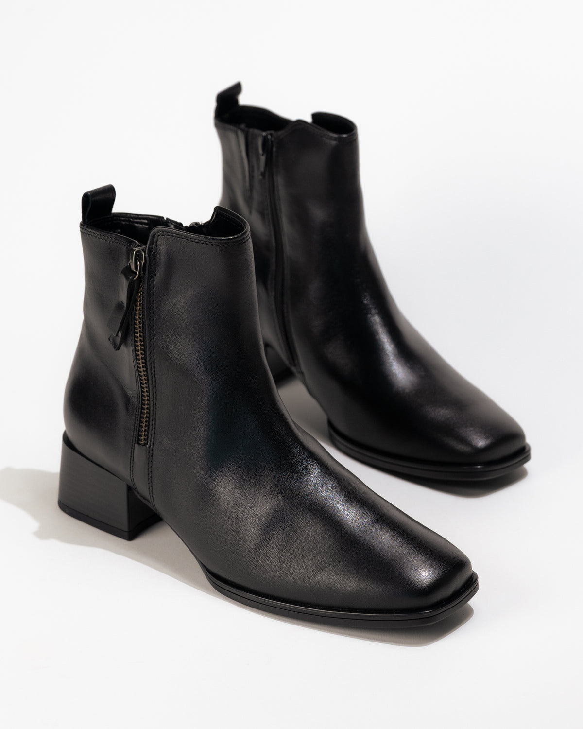 Front 3/4 view of Gabor Athen boot black leather highlighting sleek silhouette and side zipper