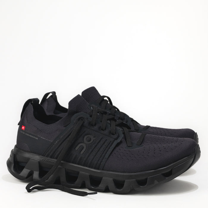Black running shoes with unique sole design on a white background.
Men's On Running Cloudswift 4 Road Running Shoe in Black/Eclipse