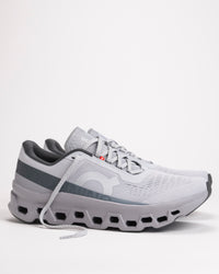 Side view of Men’s On Cloudmonster 1 in Glacier/Alloy showing CloudTec® cushioning pods