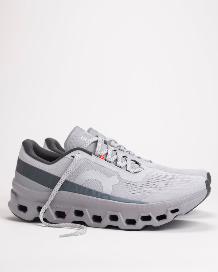 Side view of Men’s On Cloudmonster 1 in Glacier/Alloy showing CloudTec® cushioning pods