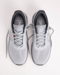 Top-down view of Men’s On Cloudmonster 1 Glacier/Alloy with breathable mesh upper and hidden eyelets