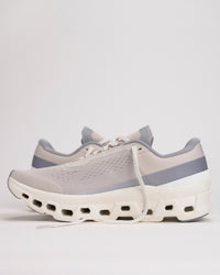 Side view of Men’s On Cloudmonster 1 running shoe in Pearl/Ivory showing CloudTec® cushioning