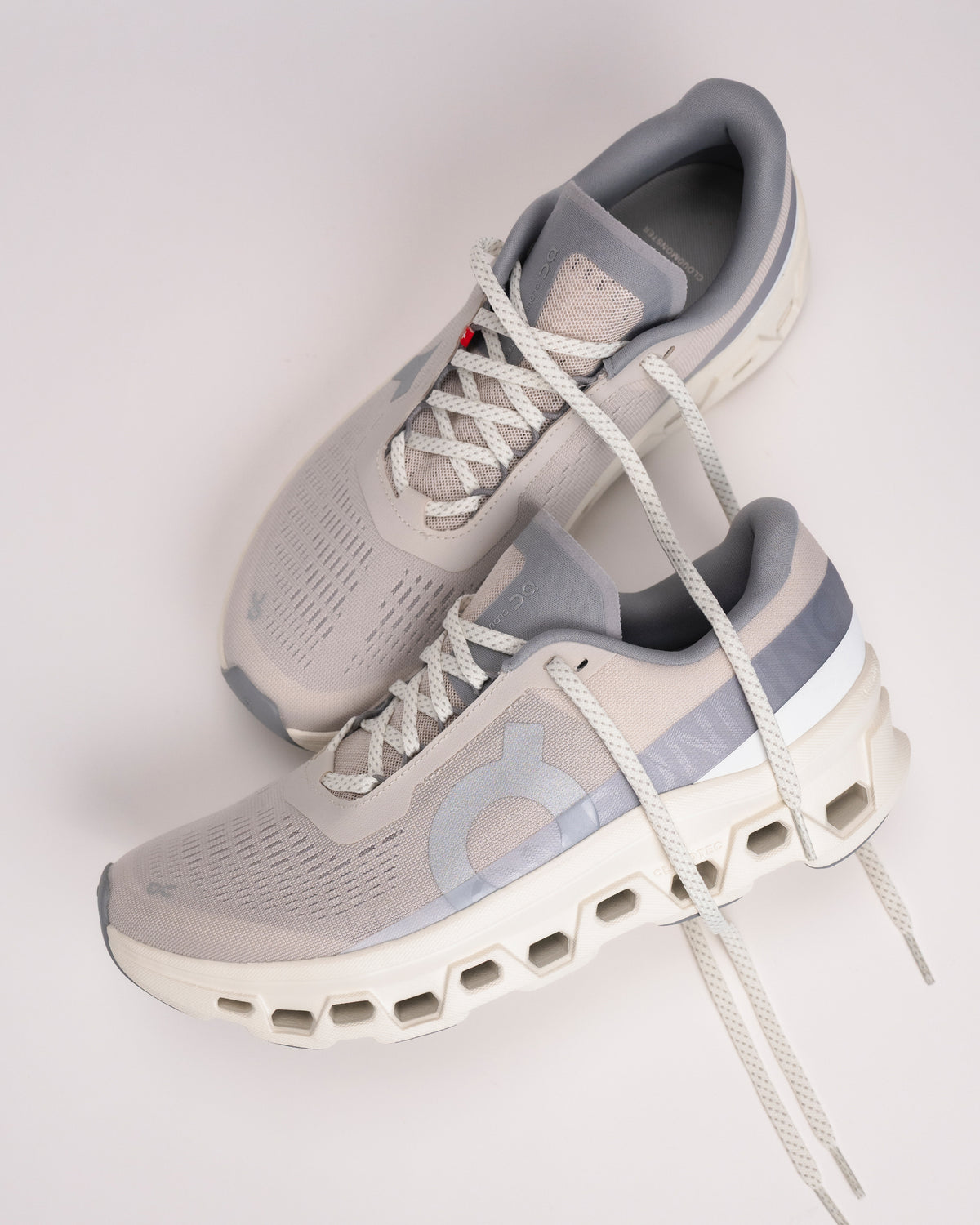 Angled view of On Cloudmonster 1 men’s shoe highlighting rocker midsole design