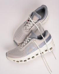 Angled view of On Cloudmonster 1 men’s shoe highlighting rocker midsole design