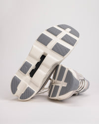 Outsole detail of Men’s On Cloudmonster 1 with CloudTec® pods for road traction