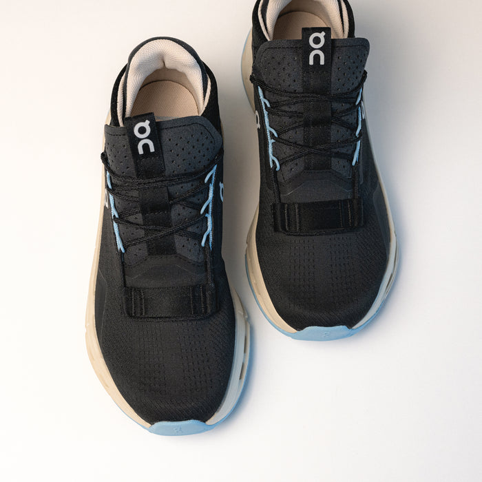 Top view of the On Running Cloudnova 2 Sneaker in Black, highlighting the wider bootie design for improved step-in comfort and stability.