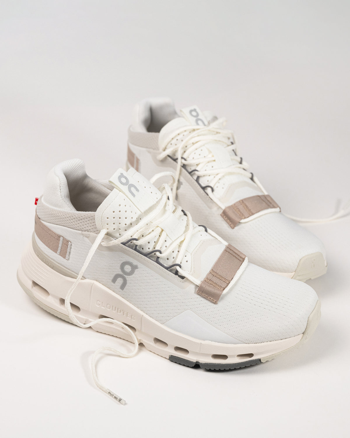 Close-up of the On Running Cloudnova 2 Sneaker in Ice/Sand, showcasing the engineered mesh upper for breathability and modern aesthetics.