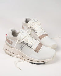 Close-up of the On Running Cloudnova 2 Sneaker in Ice/Sand, showcasing the engineered mesh upper for breathability and modern aesthetics.