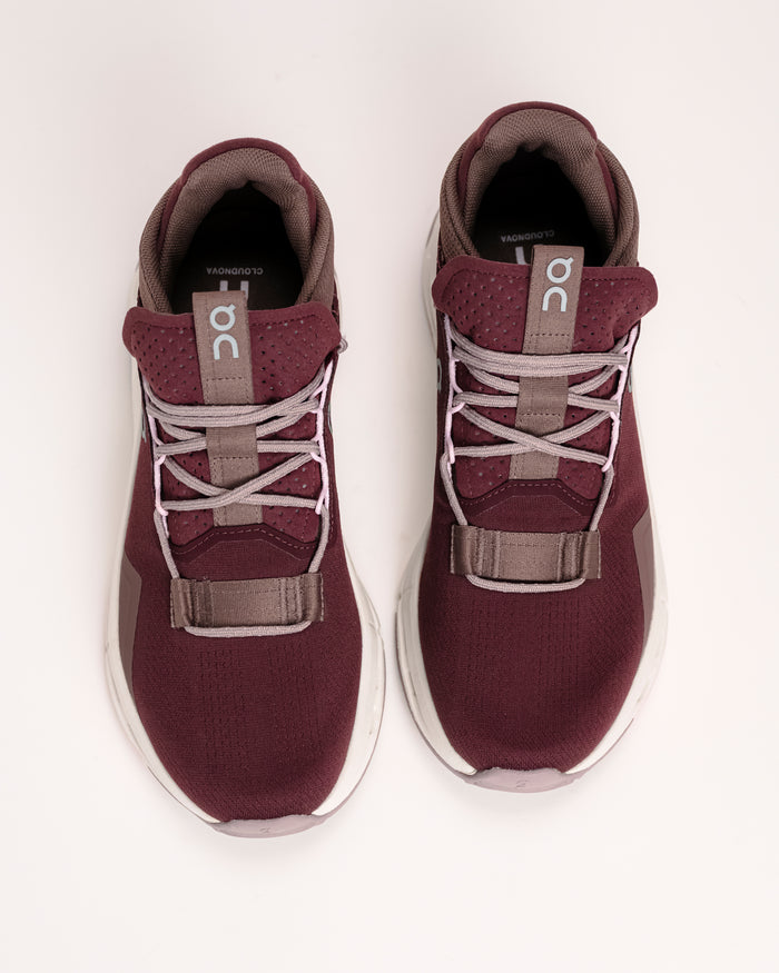 Overhead view of the Women’s On Cloudnova 2 – Performance-Inspired Lifestyle Sneaker in Maroon / Peony on a white background