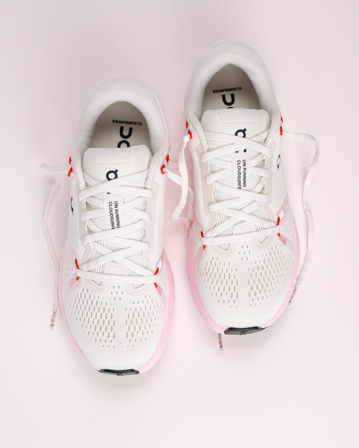overhead view of the Women’s On Cloudsurfer 2 road running shoe in ivory / peony (white, pink, red)