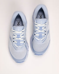 Pair of light blue On Cloudrunner 3 cushioned road running shoes on a white background