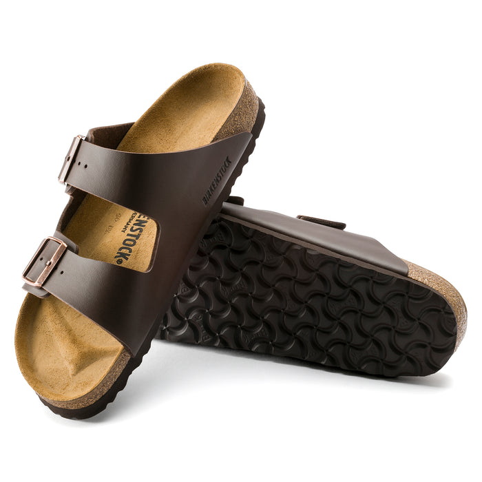 Details instep and bottom view of the Unisex BIRKENSTOCK Arizona in Brown BIRKO-FLOR, a contoured cork-latex that conforms to the shape of your foot for a custom fit.