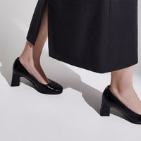 A woman wearing the Cass - Ayelet by Naot pump, showcasing the sophisticated, elevated style of the square-toe design and comfortable block heel that complements any outfit.