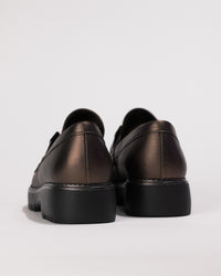 Back view of heel and stitching and outsole scalloping