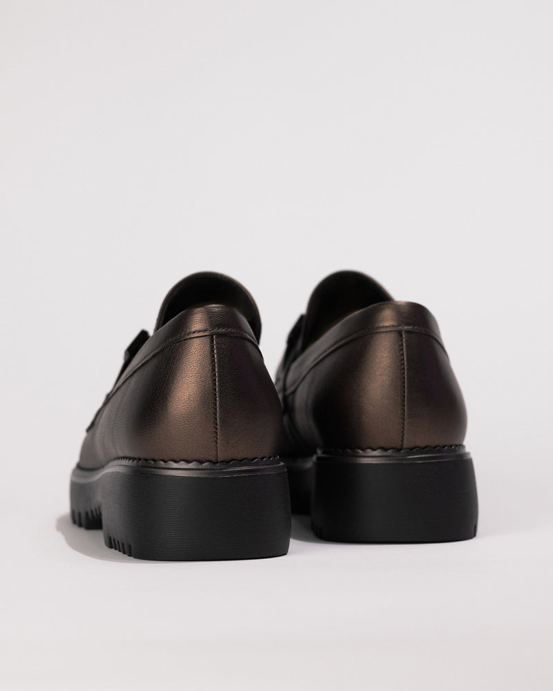 Back view of heel and stitching and outsole scalloping