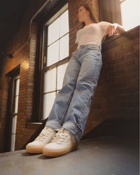 Lifestyle image of a woman wearing the Gabor Chunky Platform in White Leather Women’s Sneaker
