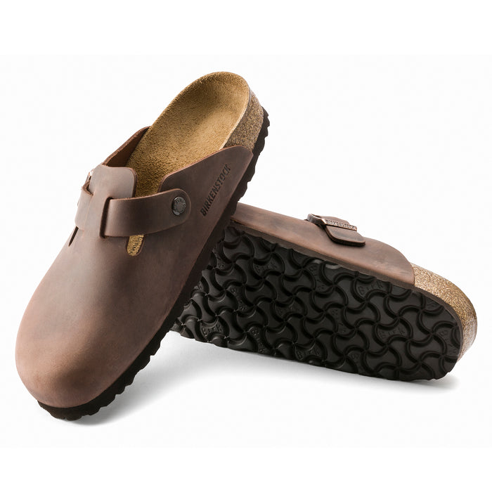 Profile and bottom sole view of the Birkenstock Boston Clog in Habana Oiled Leather a Unisex slip-on clog with an adjustable strap for the perfect fit.