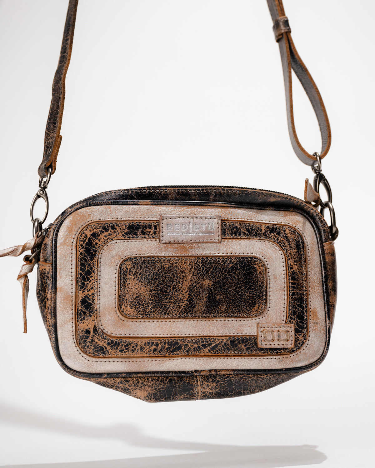 Close-up detail of leather finish on the Bed|Stü Shy compact leather crossbody bag