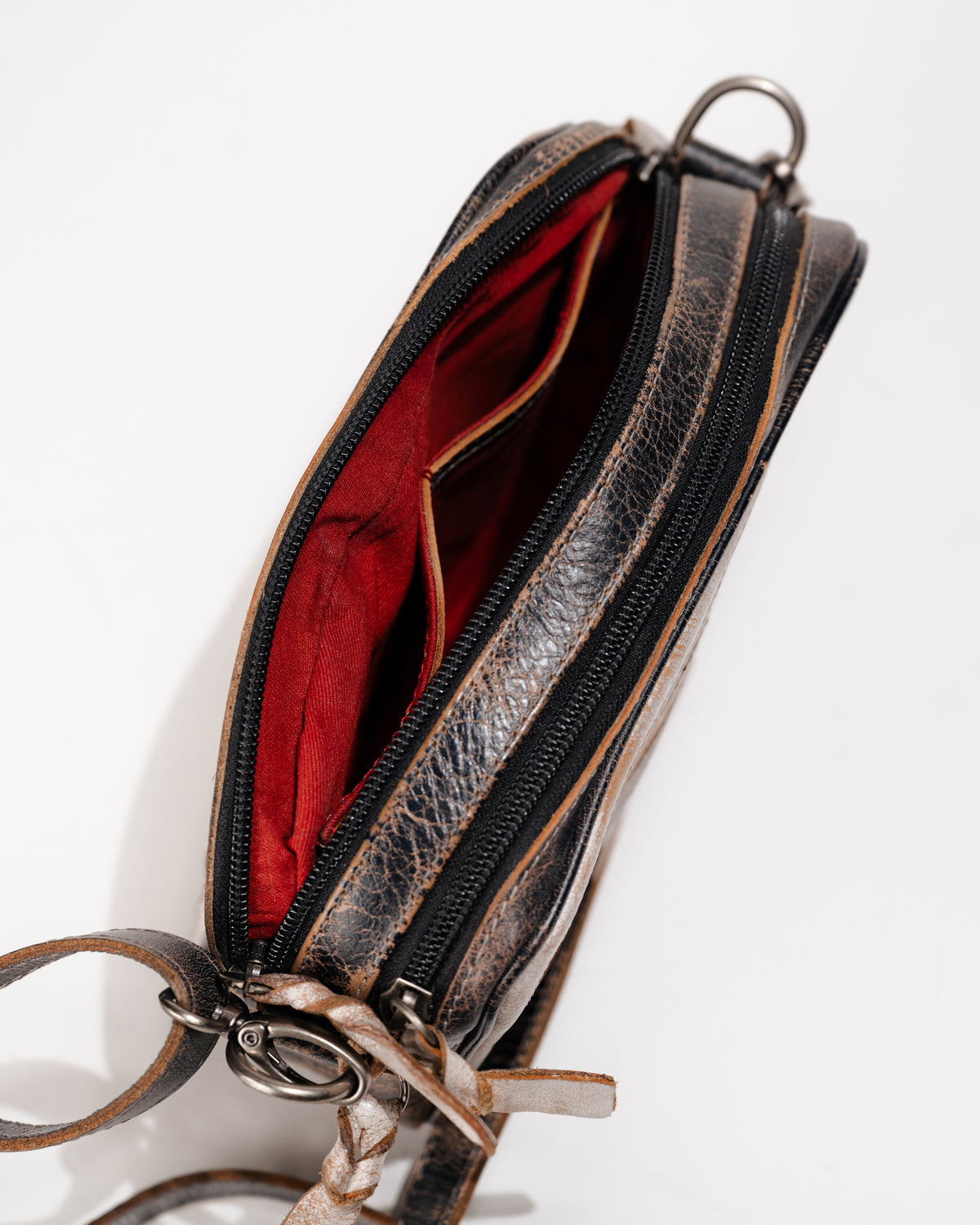 Open interior view of Bed|Stü Shy crossbody showing dual zip compartments and fabric lining