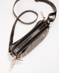 Close-up detail of leather finish and dual zip hardware on Bed|Stü Shy bag