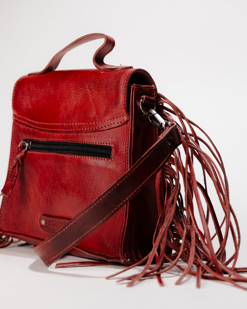 Side view of Bed|Stü Hidden leather fringe crossbody bag showing top handle and adjustable detatchable strap