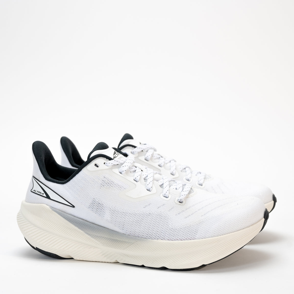 Women’s Altra Experience Flow in white side view with breathable mesh upper and rocker shape.