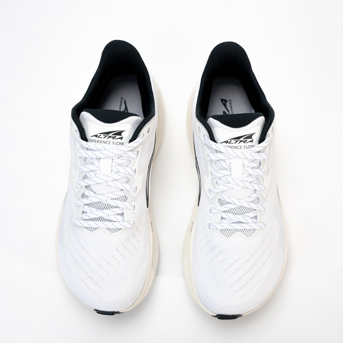 Top view of women’s Altra Experience Flow in white, highlighting FootShape™ toe box for natural movement.