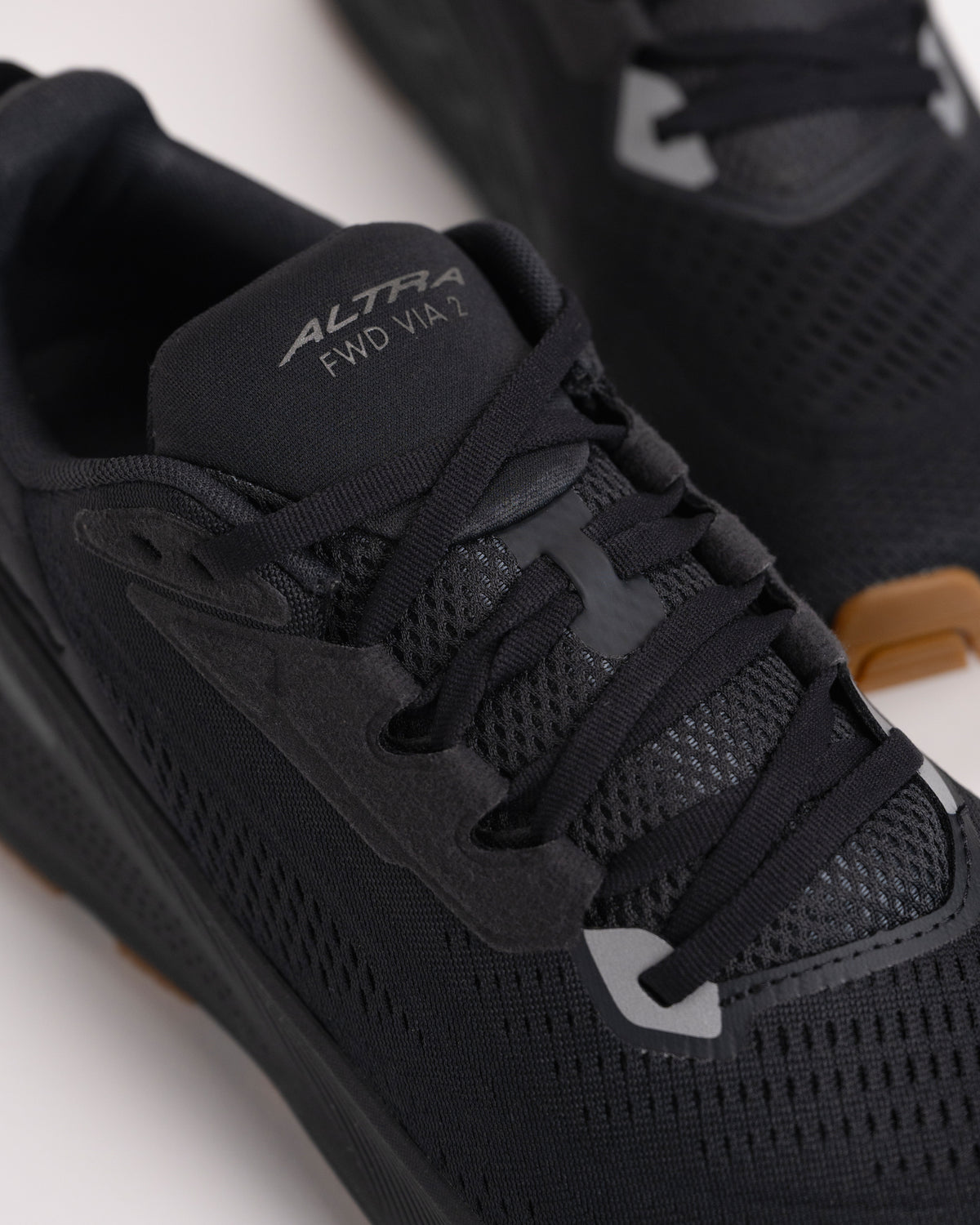 Lacing detail on the men’s Altra FWD VIA 2 in all Black color on a white background