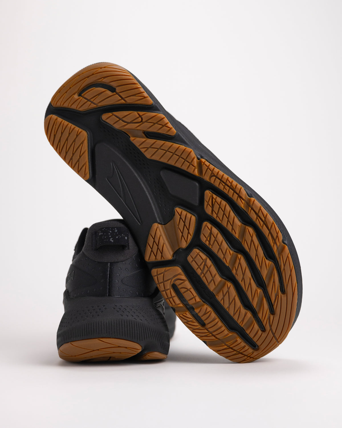 Detail shot of the grippy outsole on the men’s Altra FWD VIA 2 in black designed for on road running traction