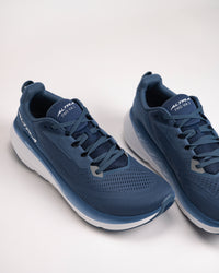 Close-up of Altra FWD VIA 2 neutral trainer showing engineered mesh upper in navy