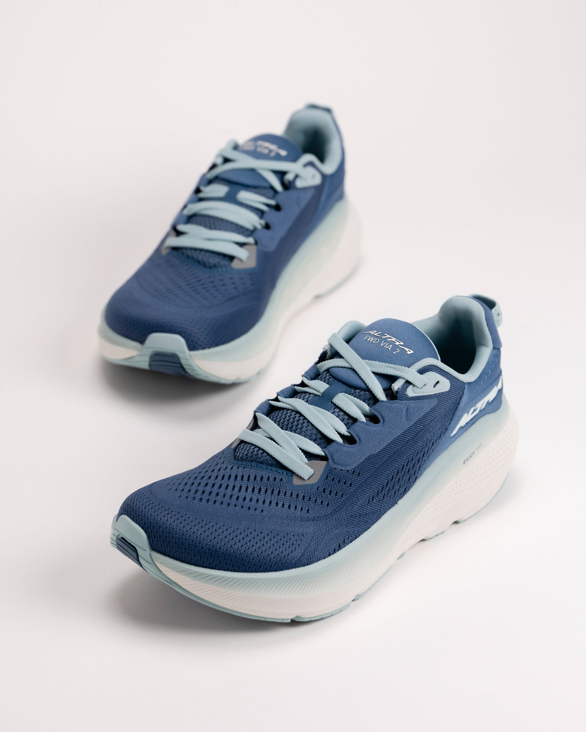 Angled view of the Altra FWD VIA 2 road running shoes in light blue color showing breathable mesh upper and lacing detail