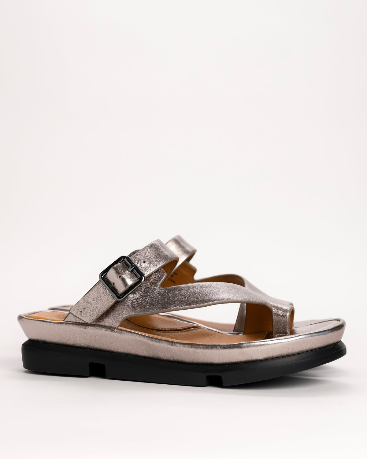 L’Amour Des Pieds Alanza slip-on toe loop sandal in Champagne leather, side view on white background
