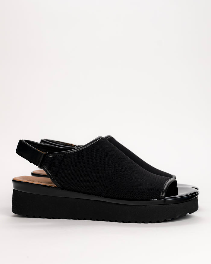 L’Amour Des Pieds Ashwin slingback platform wedge sandal in black stretch fabric side view on white background