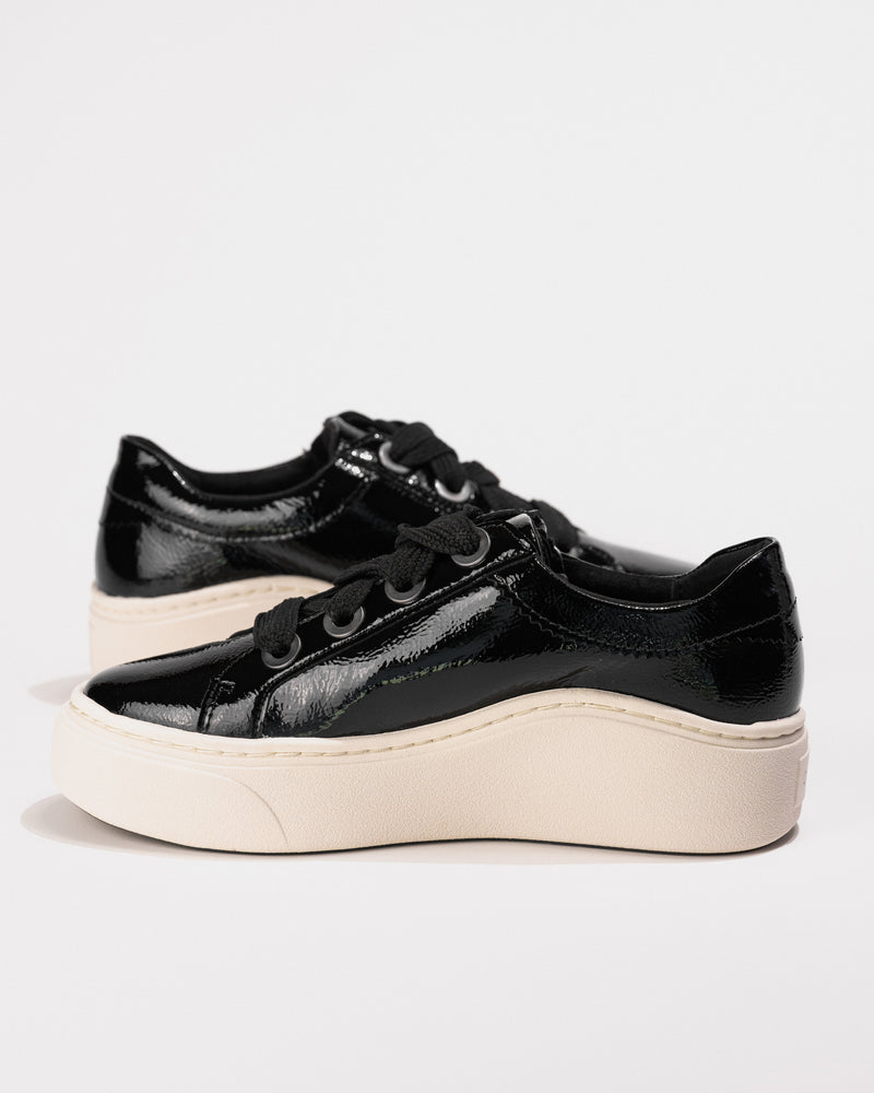 Side-stacked view of Aetrex Aubrey sneakers showing sole thickness and silhouette