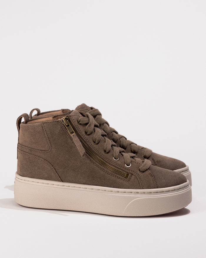 Side view of the Women's Aetrex Gianna Platform Sneaker in Taupe, showing the zip and lace design with subtle leather texture