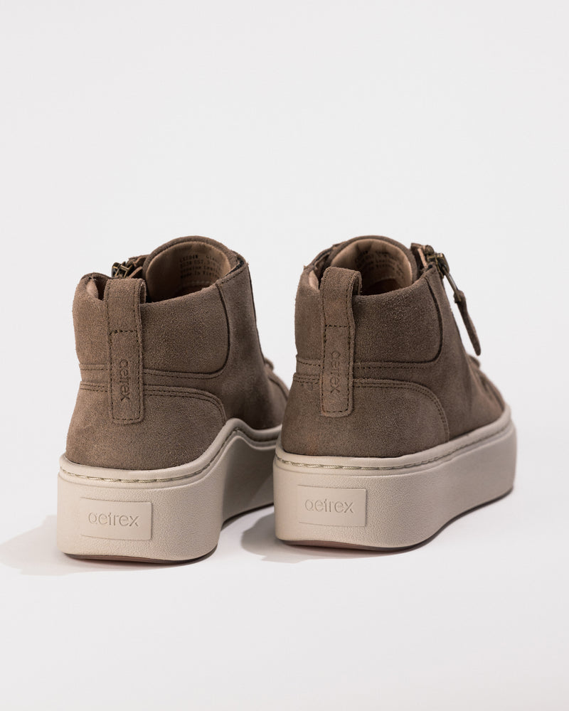 Heel view of the Women's Aetrex Gianna Platform Sneaker in Taupe, showing the zip and lace design with subtle leather texture