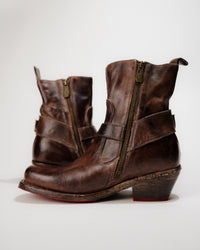 Side exterior view showing outer zipper detail and heel height of Bed|Stü Homage Boot