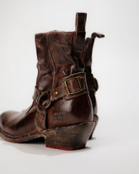 Back view of Bed|Stü Homage Boot showing wooden heel, harness strap buckle, and pull tab