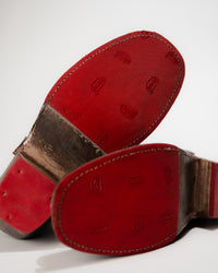 Detail bottom view of the Bed|Stü Homage Boot showing red Vibram slip-resistant outsole.