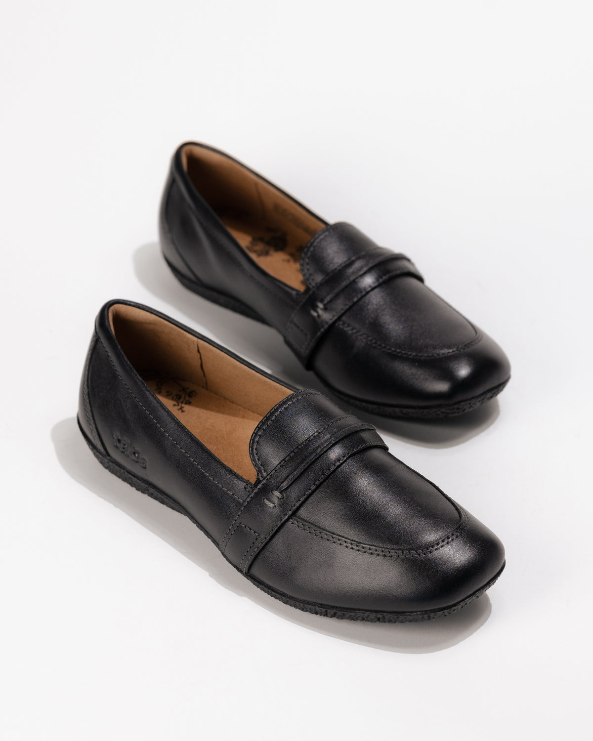 Slight overhead front view of the classic Women’s Taos Gabby Loafer – Soft Leather Slip-On in Black
