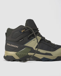Back angle highlighting ankle collar and heel design of Salomon trail boot