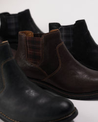 Group image of the Kaylee Chelsea Boot in multiple colorways including dark brown, black, and blue
