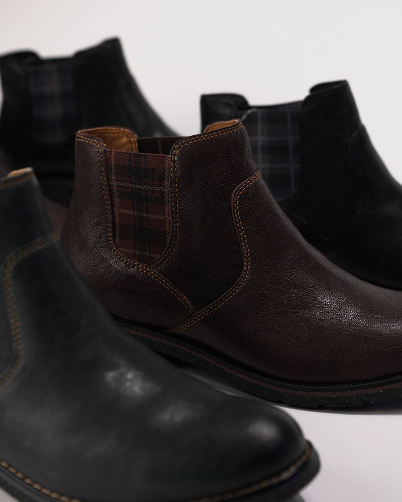 Group image of the Kaylee Chelsea Boot in multiple colorways including dark brown, black, and blue