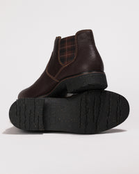 View of the rubber outsole with tread pattern for grip and flexibility