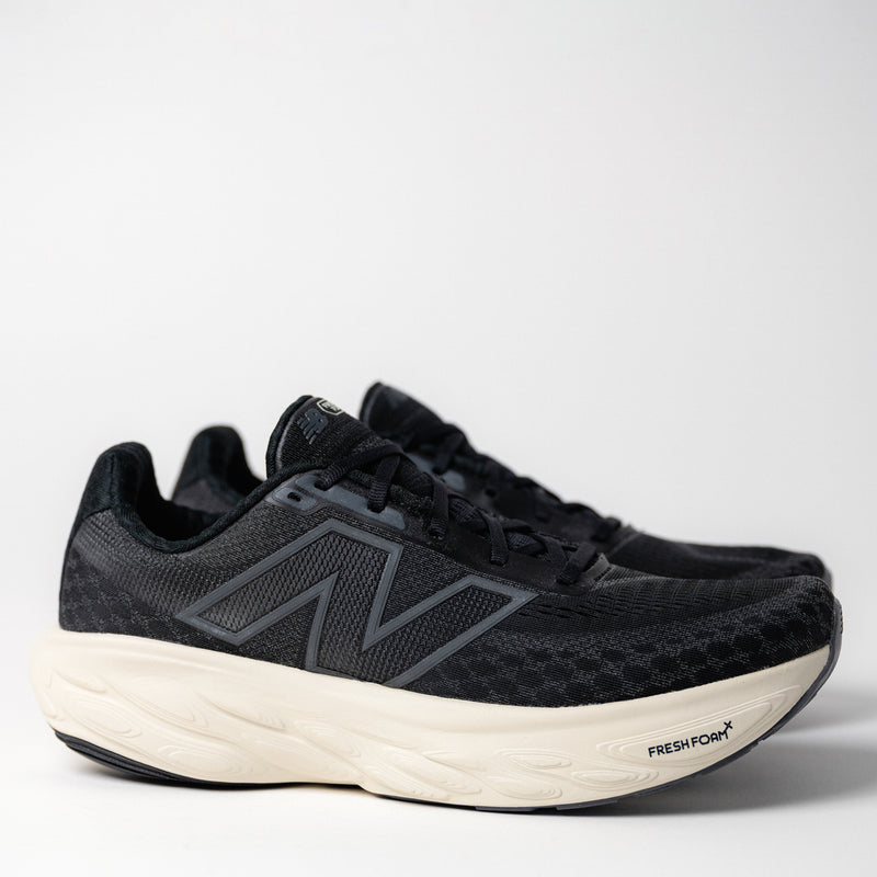 Side angle of Men's New Balance Fresh Foam X 1080 V14 in Black/Magnet, showcasing the triple jacquard mesh upper and sleek silhouette.