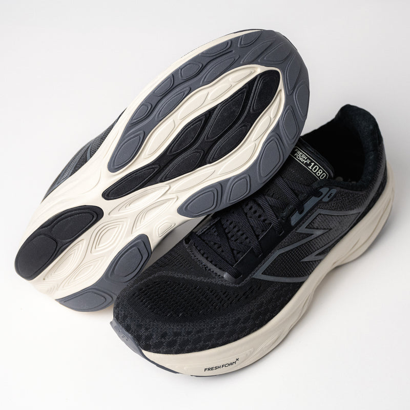 Detail sole of the Men's New Balance Fresh Foam X 1080 V14 in Black/Magnet, an everyday running shoe that boasts the Seal of Acceptance from the American Podiatric Medical Association (APMA)